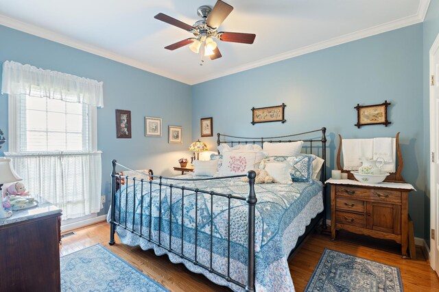500 Forrest Park Cir, Franklin, TN 37064 - bedroom with crown molding, wood finished floors, and a ceiling fan