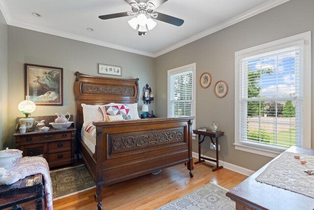 500 Forrest Park Cir, Franklin, TN 37064 - bedroom featuring multiple windows, light wood-type flooring, crown molding, and a ceiling fan