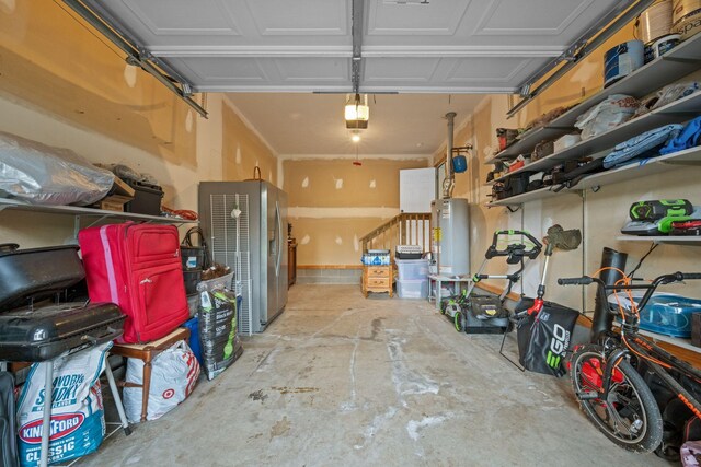 114 Silver Leaf Cir, Dickson, TN 37055 - garage with gas water heater, a garage door opener, and stainless steel refrigerator with ice dispenser