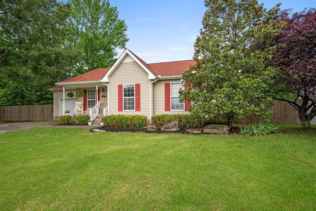 114 Silver Leaf Cir, Dickson, TN 37055 - view of front facade with dirt driveway, a shingled roof, and an attached garage