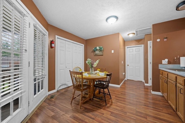 114 Silver Leaf Cir, Dickson, TN 37055 - dining area featuring dark wood-style floors and a textured ceiling