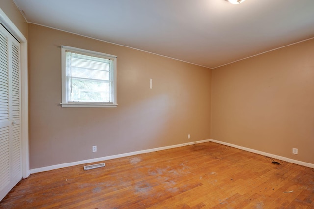 7703 Horn Tavern Rd, Fairview, TN 37062 - unfurnished bedroom featuring wood finished floors and a closet