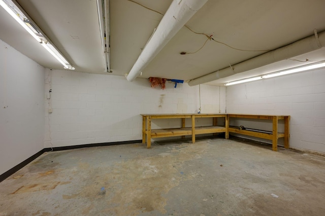 7703 Horn Tavern Rd, Fairview, TN 37062 - basement featuring a workshop area and concrete block wall