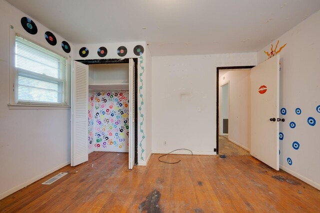 7703 Horn Tavern Rd, Fairview, TN 37062 - unfurnished bedroom featuring hardwood / wood-style flooring and a closet
