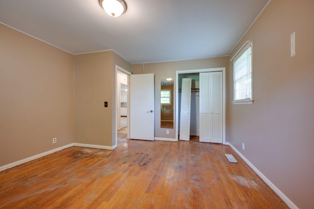 7703 Horn Tavern Rd, Fairview, TN 37062 - unfurnished bedroom featuring hardwood / wood-style floors and a closet