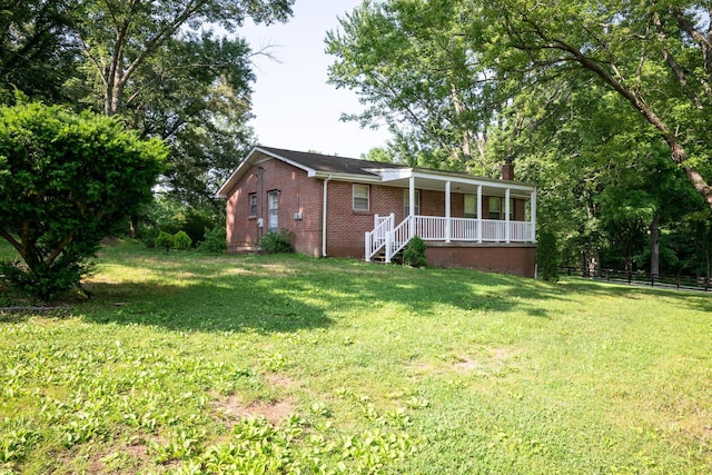 7703 Horn Tavern Rd, Fairview, TN 37062 - rear view of house with covered porch, brick siding, and a chimney