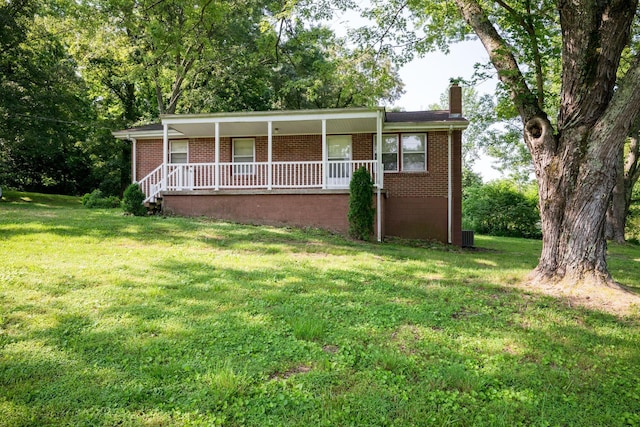 7703 Horn Tavern Rd, Fairview, TN 37062 - single story home featuring brick siding, a porch, a chimney, and a front lawn