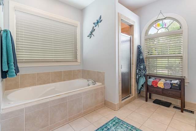 673 Newton Ln, Gallatin, TN 37066 - bathroom featuring a stall shower, a bath, and tile patterned floors
