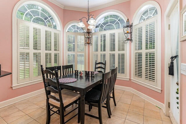 673 Newton Ln, Gallatin, TN 37066 - dining area with light tile patterned floors, a chandelier, and crown molding