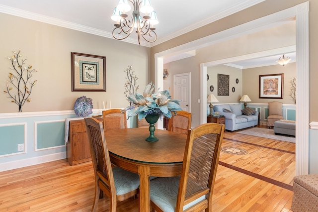673 Newton Ln, Gallatin, TN 37066 - dining area with a chandelier, light wood finished floors, and crown molding