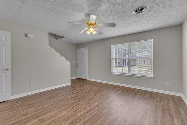 1512 Center Pointe Dr, Murfreesboro, TN 37130 - empty room with wood finished floors, ceiling fan, baseboards, and a textured ceiling