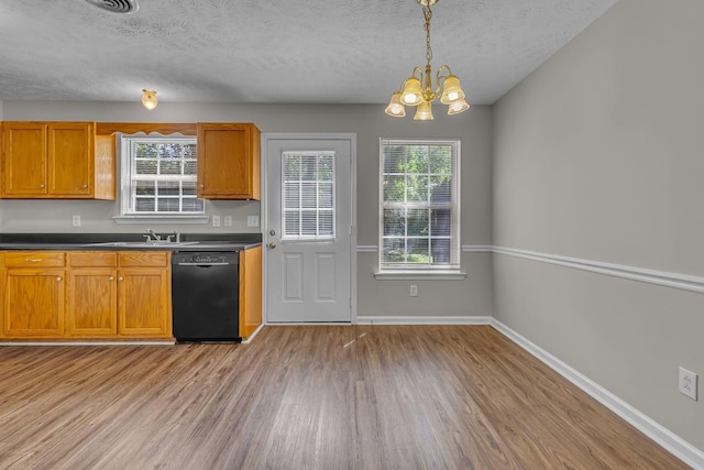 1512 Center Pointe Dr, Murfreesboro, TN 37130 - kitchen featuring dishwasher, light wood-style floors, a chandelier, healthy amount of natural light, and a textured ceiling