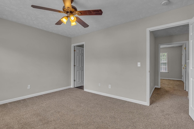 1512 Center Pointe Dr, Murfreesboro, TN 37130 - spare room with carpet floors, a ceiling fan, baseboards, a textured ceiling, and a smoke detector