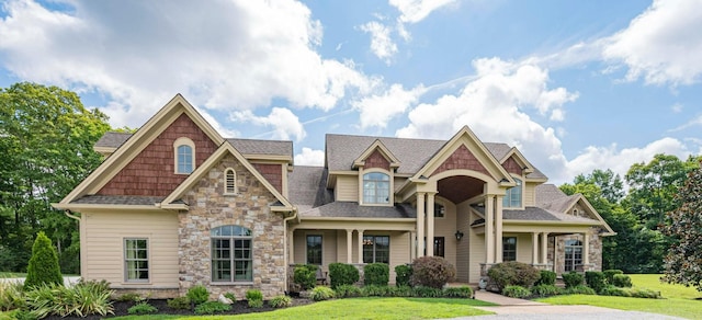872 Pinnacle Hill Rd, Kingston Springs, TN 37082 - view of front of home featuring stone siding, a front yard, and a shingled roof