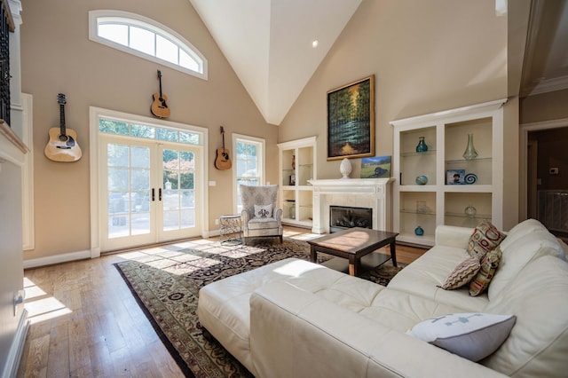 872 Pinnacle Hill Rd, Kingston Springs, TN 37082 - living room with high vaulted ceiling, french doors, wood finished floors, and a fireplace