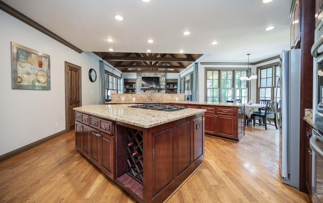 872 Pinnacle Hill Rd, Kingston Springs, TN 37082 - kitchen with recessed lighting, ornamental molding, light wood finished floors, a large island, and gas cooktop