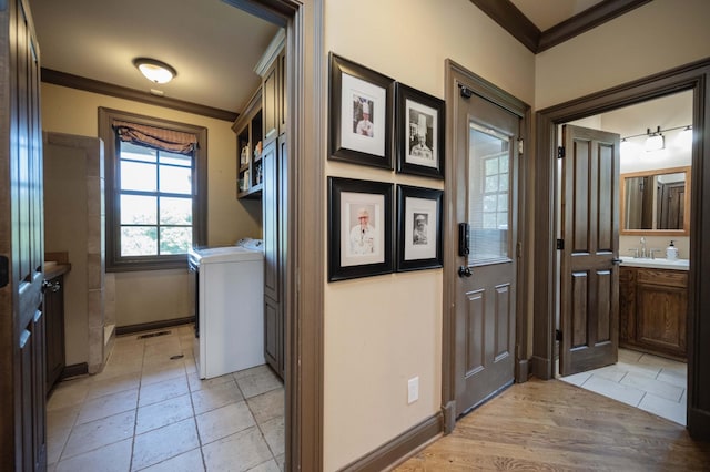 872 Pinnacle Hill Rd, Kingston Springs, TN 37082 - washroom with ornamental molding and washer / dryer