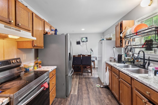 4145 Providence Park Ln, Nashville, TN 37211 - kitchen with electric stove, under cabinet range hood, a sink, dark wood-style flooring, and brown cabinetry