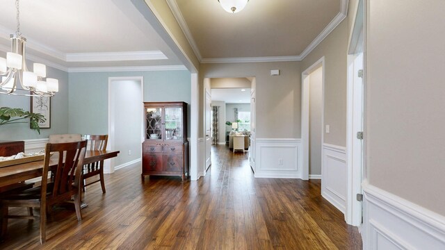 2809 Kaye Dr, Thompsons Station, TN 37179 - dining space featuring a chandelier, dark wood-style flooring, ornamental molding, and a wainscoted wall