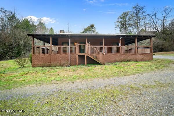 1999 E Mountain View Way, Sevierville, TN 37862 - log-style house featuring a wooden deck