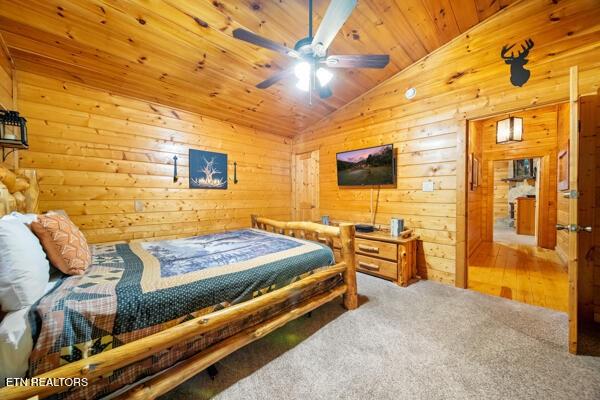 1999 E Mountain View Way, Sevierville, TN 37862 - carpeted bedroom featuring vaulted ceiling, wooden walls, and wooden ceiling