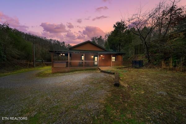 1999 E Mountain View Way, Sevierville, TN 37862 - rustic home with covered porch and dirt driveway