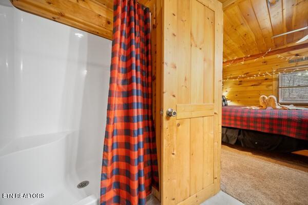 1999 E Mountain View Way, Sevierville, TN 37862 - full bath featuring wooden walls, curtained shower, and wooden ceiling