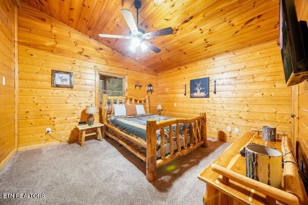 1999 E Mountain View Way, Sevierville, TN 37862 - bedroom featuring carpet floors, vaulted ceiling, wood walls, and wooden ceiling