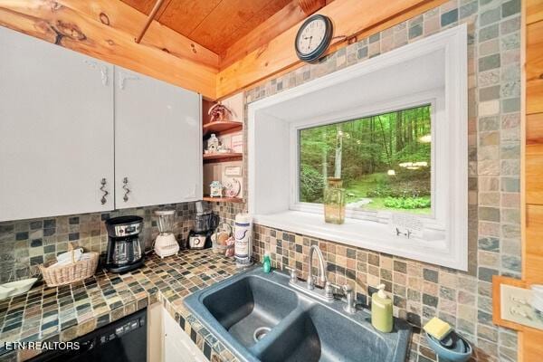 3127 Emerald Springs Loop, Sevierville, TN 37862 - kitchen with a sink, decorative backsplash, white cabinetry, open shelves, and tile counters