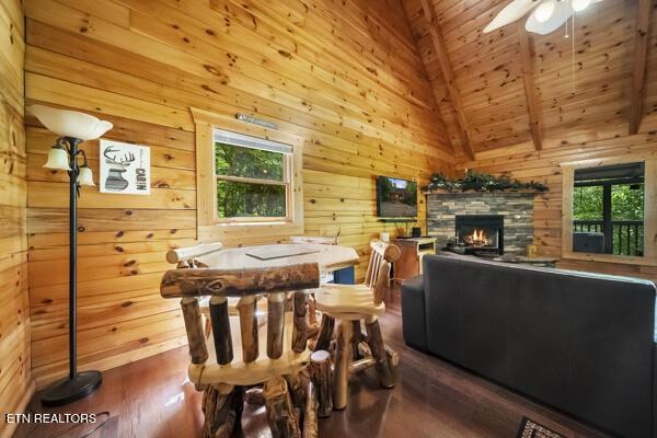 4196 Mountain Rest Way, Sevierville, TN 37876 - dining space featuring wooden walls, a ceiling fan, wood finished floors, wood ceiling, and a fireplace