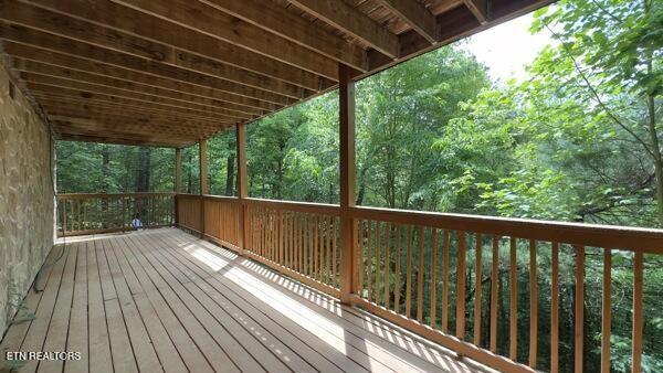 4196 Mountain Rest Way, Sevierville, TN 37876 - wooden deck with a forest view