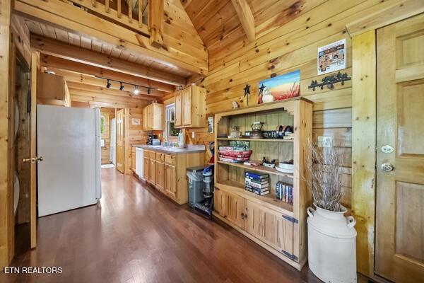 4196 Mountain Rest Way, Sevierville, TN 37876 - kitchen featuring freestanding refrigerator, dark wood-style flooring, vaulted ceiling, wooden walls, and wood ceiling