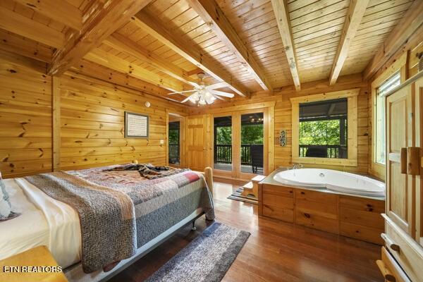 4196 Mountain Rest Way, Sevierville, TN 37876 - bedroom with access to outside, wood finished floors, wooden ceiling with exposed beams, and wooden walls