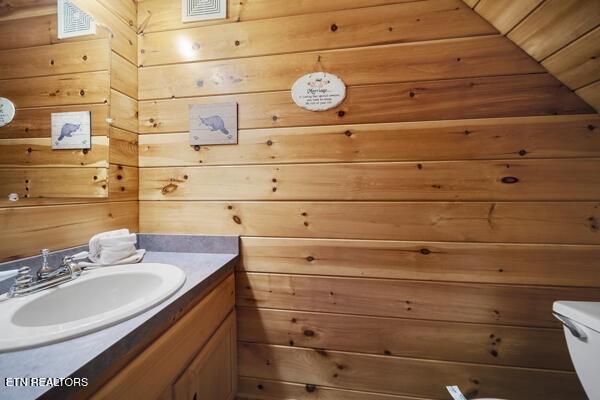 4196 Mountain Rest Way, Sevierville, TN 37876 - half bath with vanity, toilet, and wooden walls