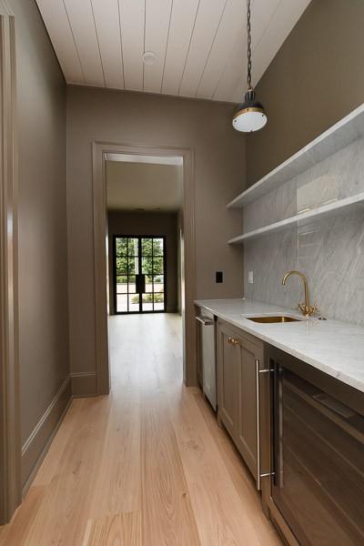 1302B Pillow St, Nashville, TN 37203 - kitchen featuring open shelves, wine cooler, a sink, light wood finished floors, and dishwasher