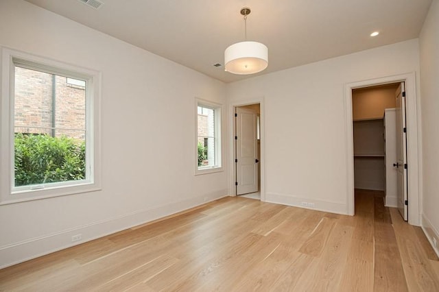 1302B Pillow St, Nashville, TN 37203 - spare room featuring plenty of natural light, light wood-type flooring, and baseboards