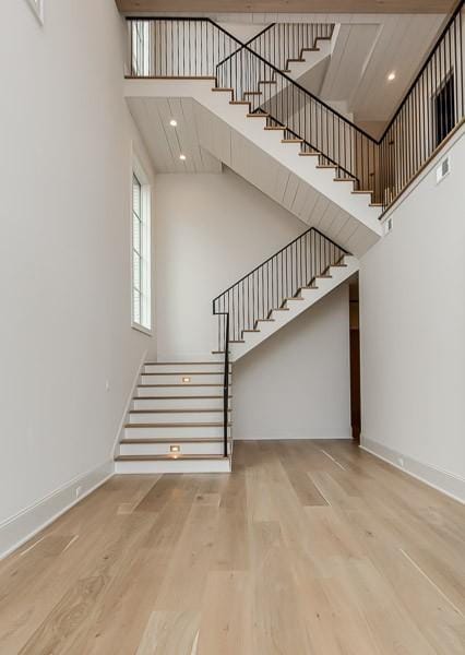 1302B Pillow St, Nashville, TN 37203 - stairs featuring a towering ceiling, wood finished floors, and baseboards