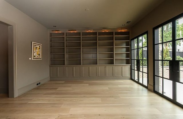 1302B Pillow St, Nashville, TN 37203 - empty room with light wood-style flooring and built in features