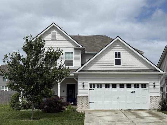 312 Whisper Wood Way, Lebanon, TN 37087 - view of front of house featuring concrete driveway, an attached garage, stone siding, a shingled roof, and a front lawn