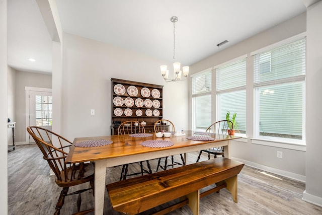 312 Whisper Wood Way, Lebanon, TN 37087 - dining area with light wood-style floors and a chandelier