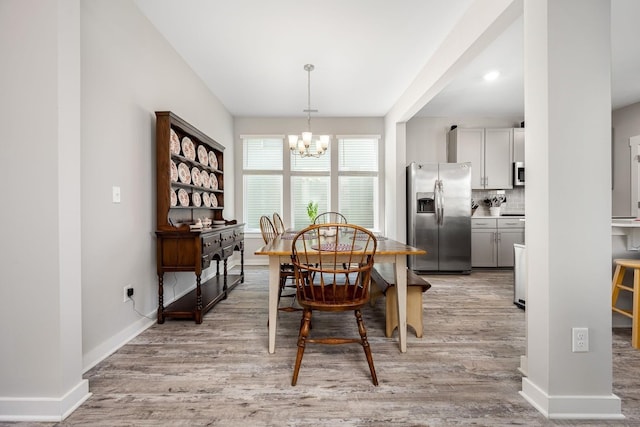 312 Whisper Wood Way, Lebanon, TN 37087 - dining area with a chandelier and light wood-type flooring