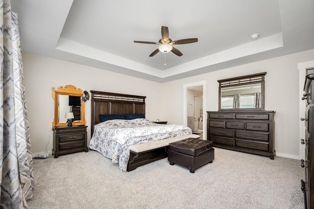 312 Whisper Wood Way, Lebanon, TN 37087 - bedroom featuring a tray ceiling, light carpet, ceiling fan, and ensuite bathroom