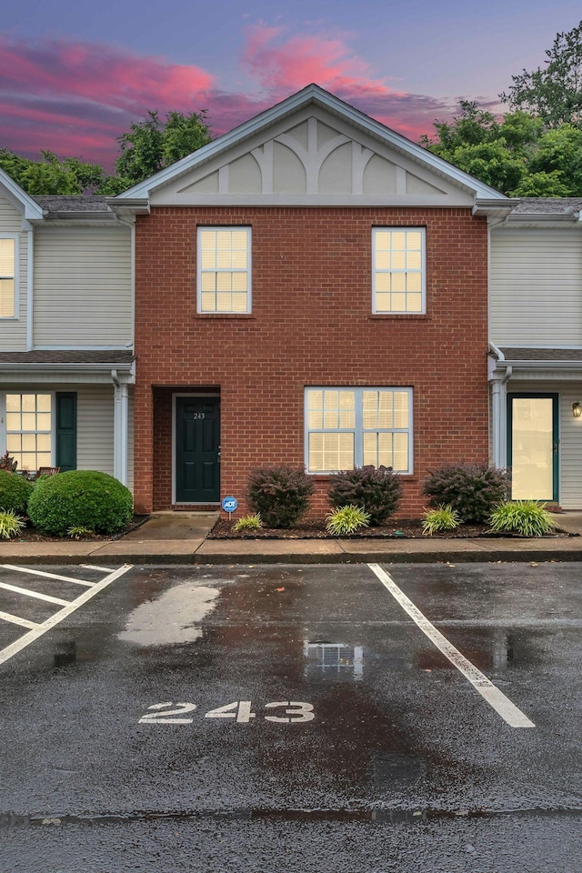 243 Shoshone Pl, Murfreesboro, TN 37128 - view of property featuring uncovered parking and brick siding
