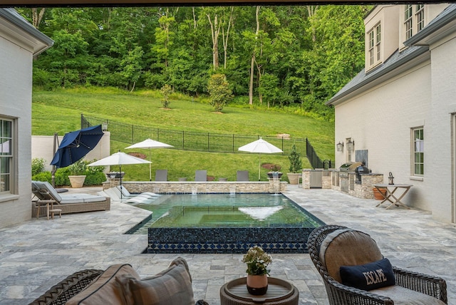 1024 Vaughn Crest Dr, Franklin, TN 37069 - view of swimming pool with area for grilling, a fenced backyard, and a patio area