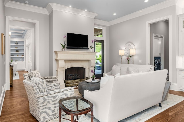 1024 Vaughn Crest Dr, Franklin, TN 37069 - living room with wood finished floors, ornamental molding, recessed lighting, washer / dryer, and a high end fireplace