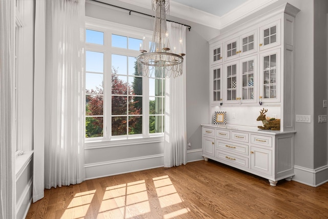 1024 Vaughn Crest Dr, Franklin, TN 37069 - dining room with a chandelier, crown molding, healthy amount of natural light, and wood finished floors