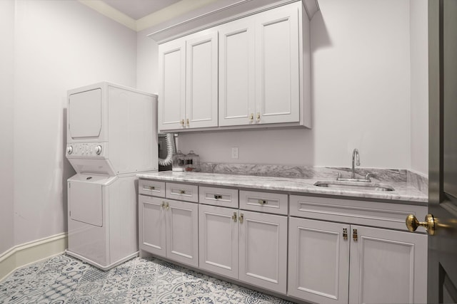 1024 Vaughn Crest Dr, Franklin, TN 37069 - laundry area with stacked washer / dryer and cabinet space