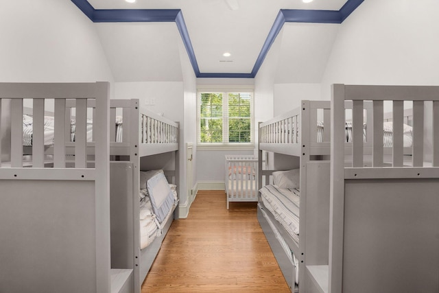 1024 Vaughn Crest Dr, Franklin, TN 37069 - bedroom featuring ornamental molding, wood finished floors, and a nursery area