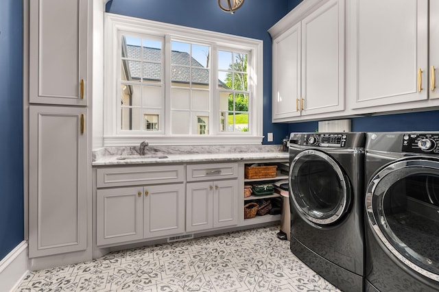 1024 Vaughn Crest Dr, Franklin, TN 37069 - laundry room featuring cabinet space, separate washer and dryer, and light tile patterned floors