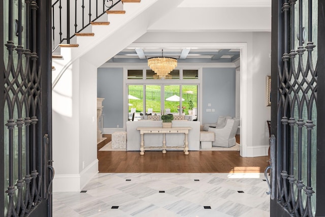 1024 Vaughn Crest Dr, Franklin, TN 37069 - entryway featuring coffered ceiling, a chandelier, beam ceiling, and ornamental molding